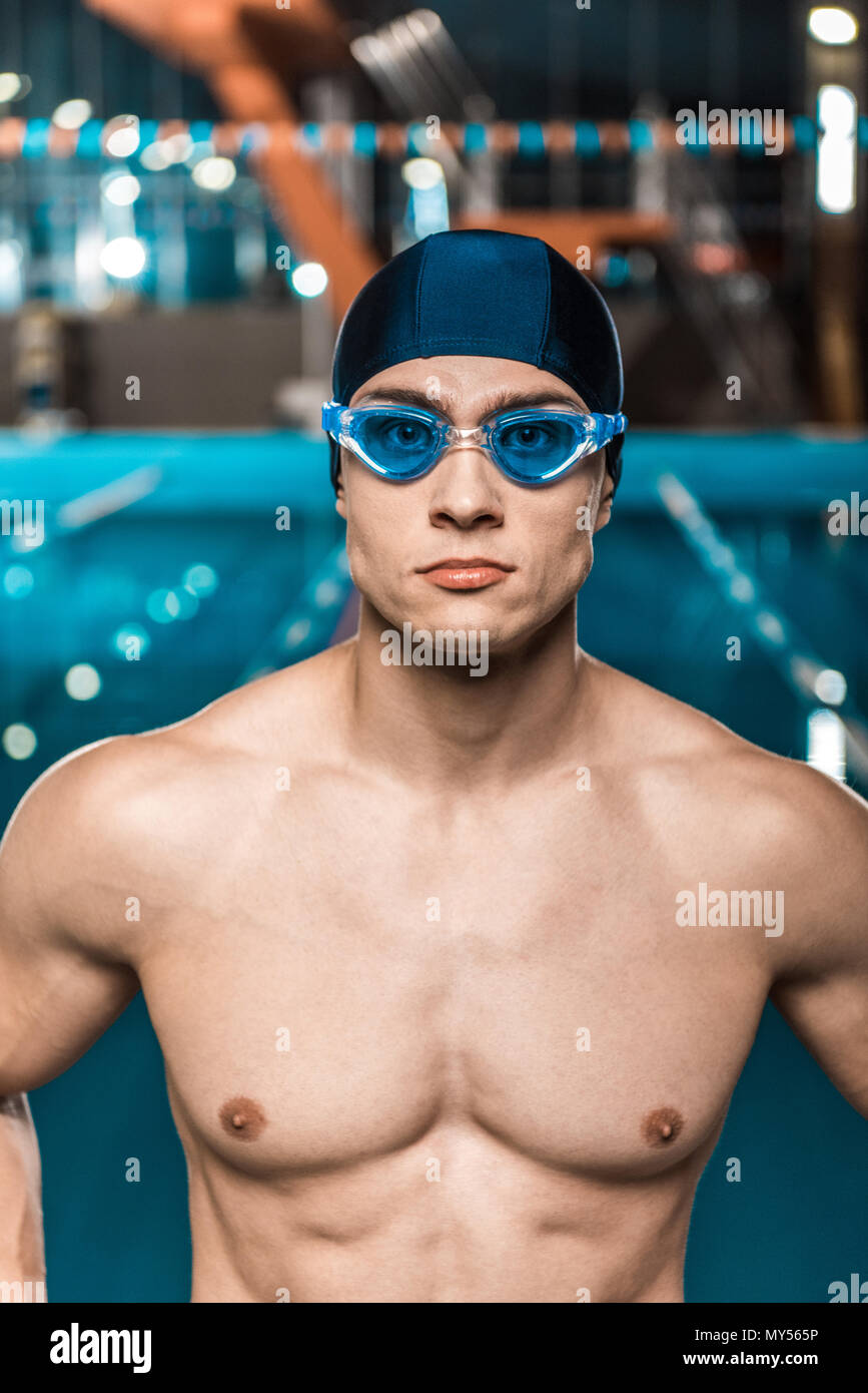 handsome muscular swimmer in swimming cap and goggles Stock Photo Alamy