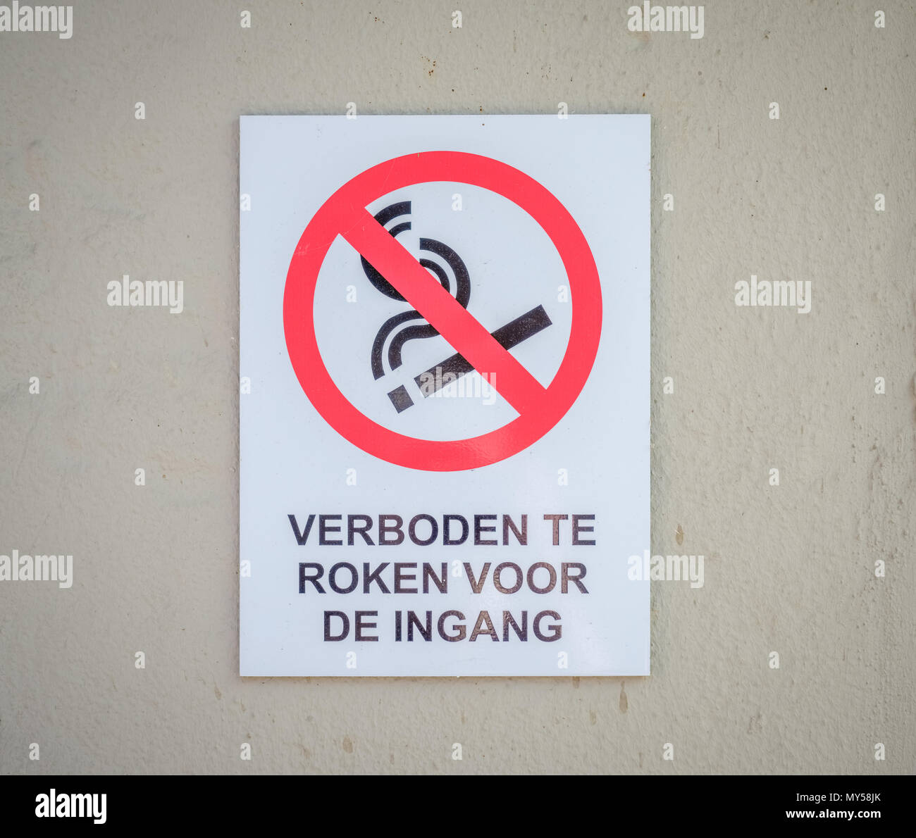 A sign at the entrance of a Dutch public building is indicating that smoking is not allowed. Stock Photo