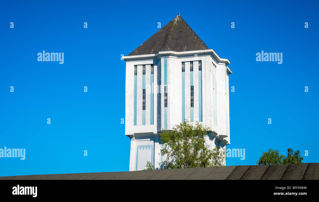 Located at the Reggestreet in de Dutch city of Almelo stands the famous water tower. The national monument built in 1926 is 38 meters tall. Stock Photo
