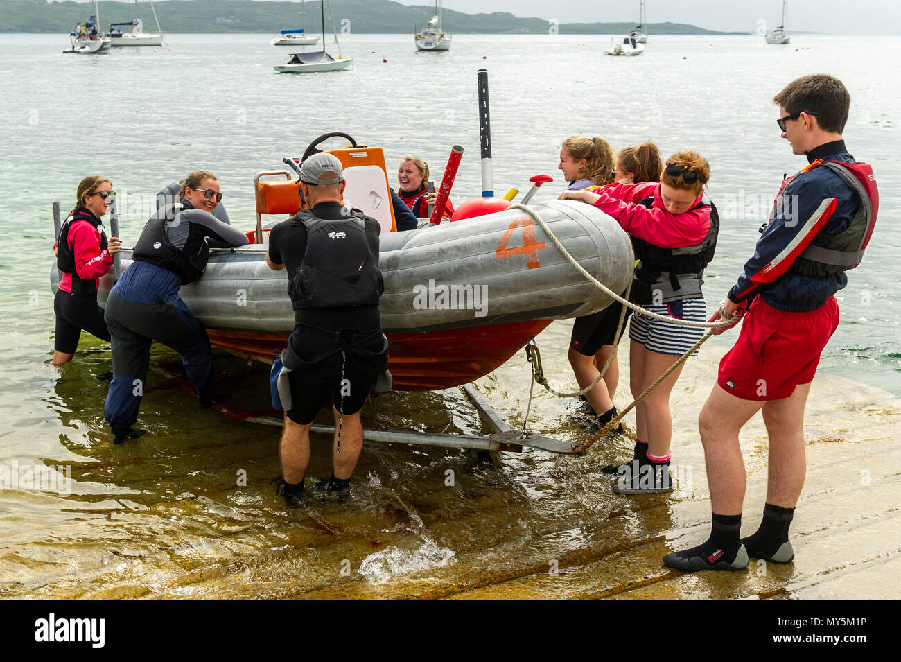 Schull, Ireland. 6th June, 2018. After a dull and overcast start this morning, the sun will burn off the clouds and make an appearance this afternoon giving highs of 21 C. Participants undertaking a Dinghy Instructor Course at Fastnet Marine Outdoor Education Centre in Schull launch a RIB as part of their training.  Credit: Andy Gibson/Alamy Live News. Stock Photo