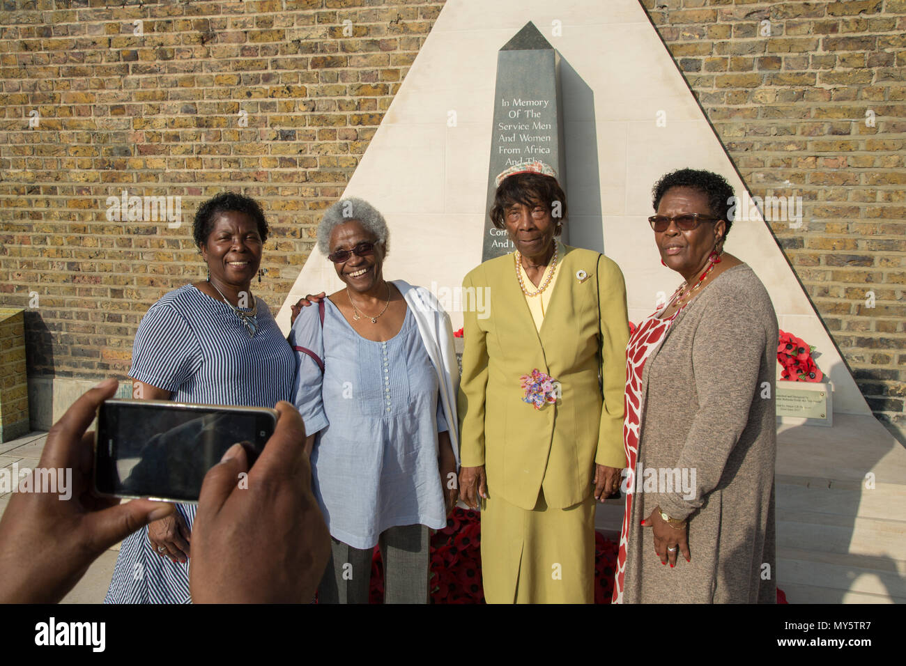 London Uk 6th June 2018 Caribbean nurses who were invited to come to Britain after World War Two, to assist with labour shortages and later became known as the 'Windrush Generation.' in front of the The African and Caribbean War Memorial in Brixton. Credit: Thabo Jaiyesimi/Alamy Live News Stock Photo