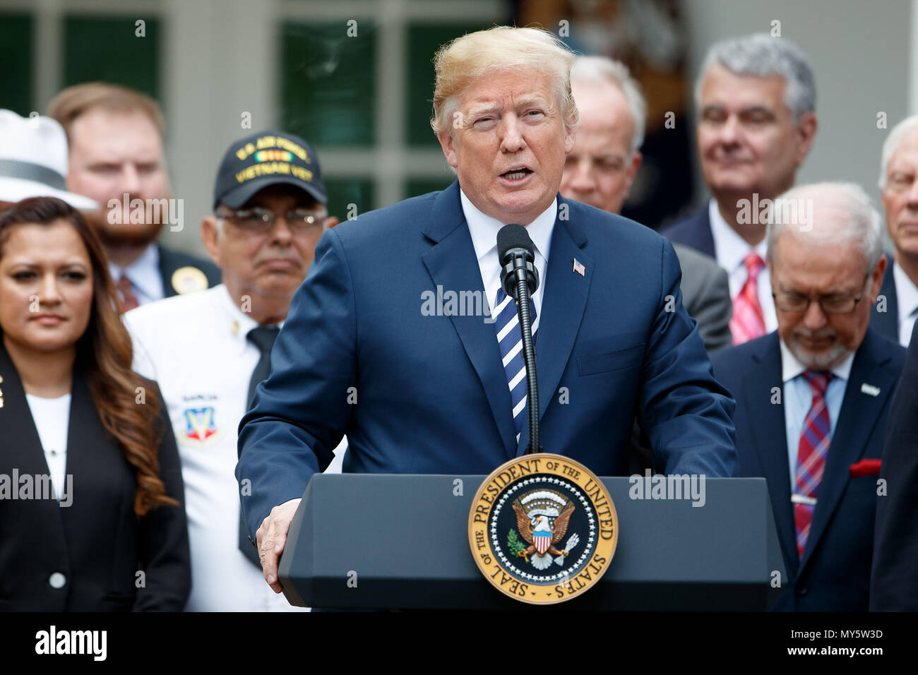 Washington, USA. 6th June, 2018. U.S. President Donald Trump (Front) speaks during a bill signing ceremony for the 'VA Mission Act of 2018' in the Rose Garden of the White House in Washington, DC, the United States, on June 6, 2018. Credit: Ting Shen/Xinhua/Alamy Live News Stock Photo