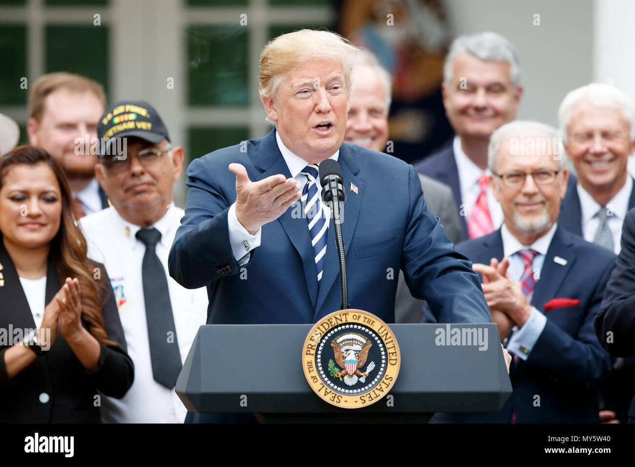Washington, USA. 6th June, 2018. U.S. President Donald Trump (Front) speaks during a bill signing ceremony for the 'VA Mission Act of 2018' in the Rose Garden of the White House in Washington, DC, the United States, on June 6, 2018. Credit: Ting Shen/Xinhua/Alamy Live News Stock Photo