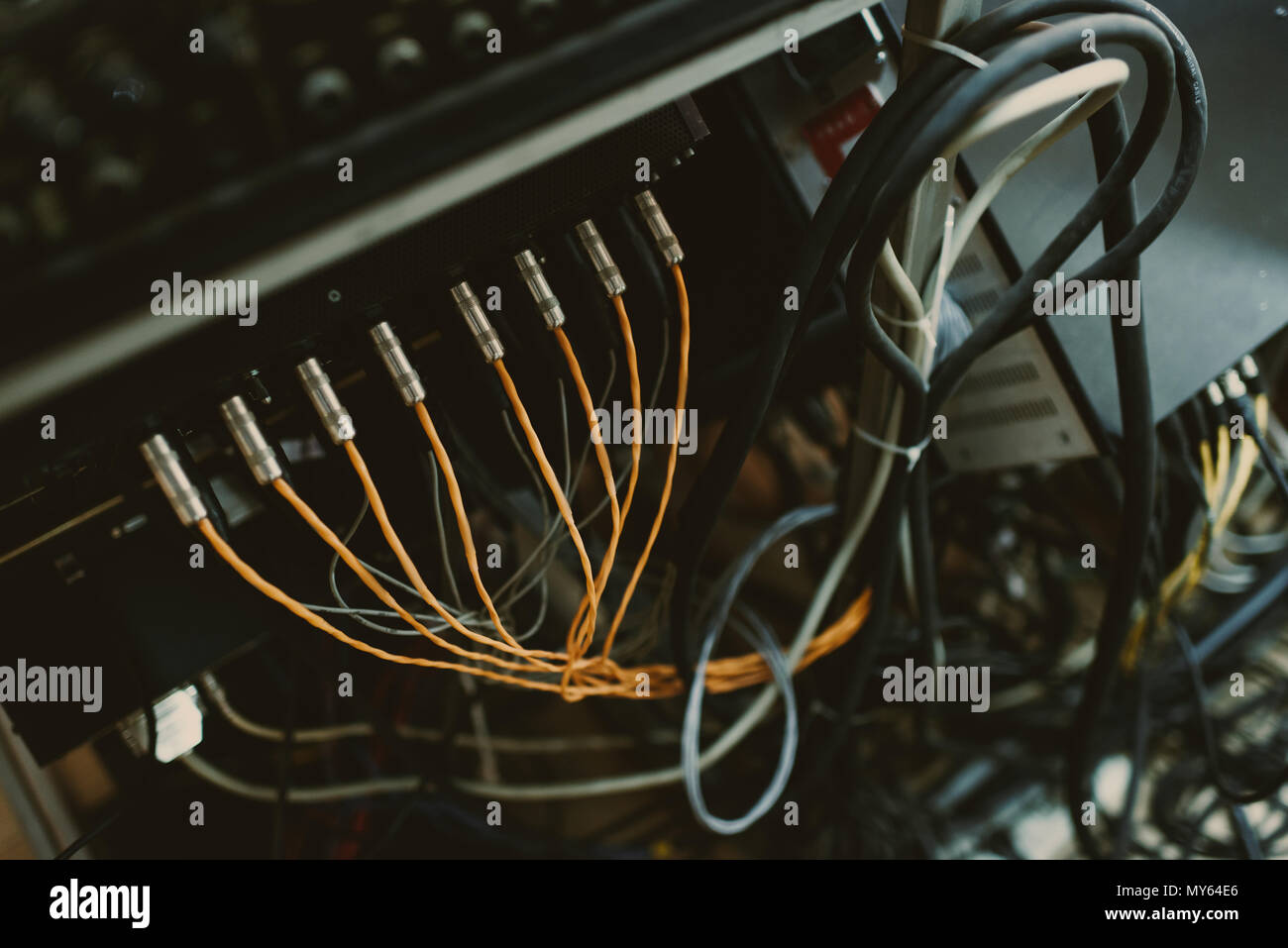 top view of wires pluged into sound amplifiers Stock Photo