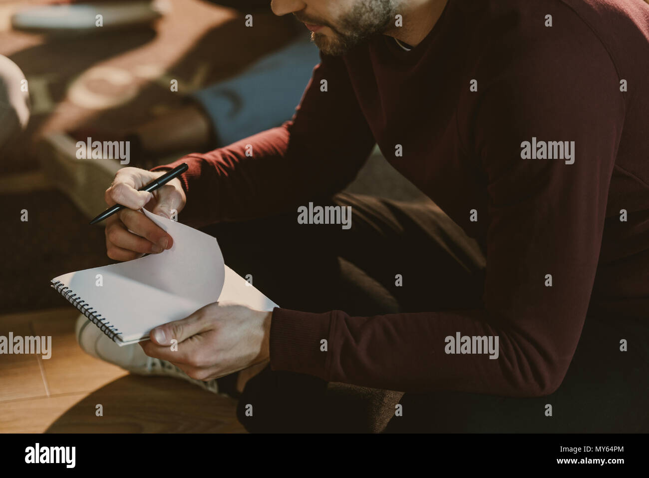 Man thinking writing on notepad hi-res stock photography and images - Alamy