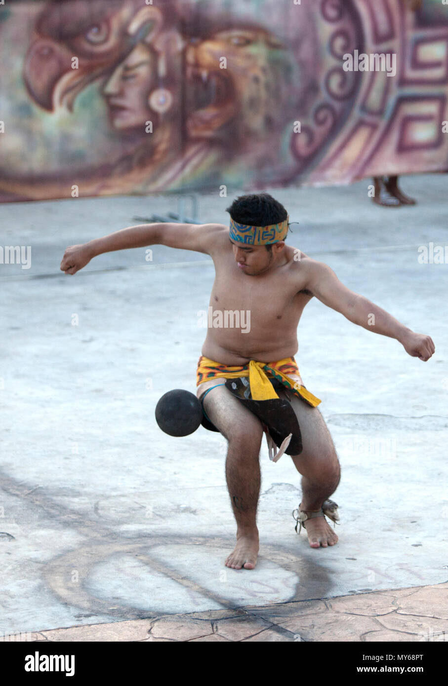 A Mayan Ball Player from Chapab de las Flores team hits the ball with his hip during the first ¬Pok Ta Pok¬ World Cup in Piste, Tinum, Yucatan, Mexico Stock Photo