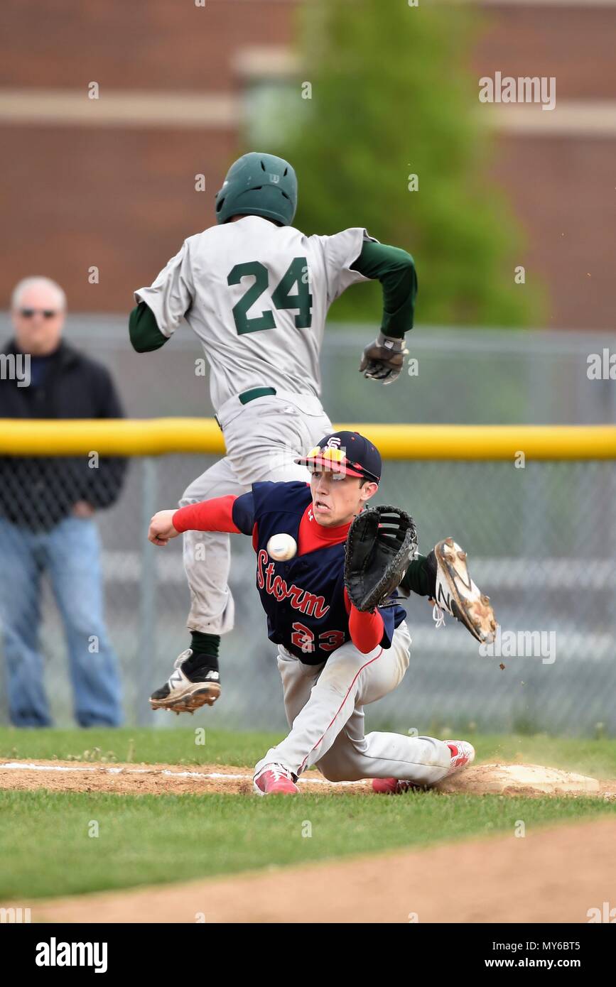 Batter/runner beating out an infield hit as the opposing first baseman