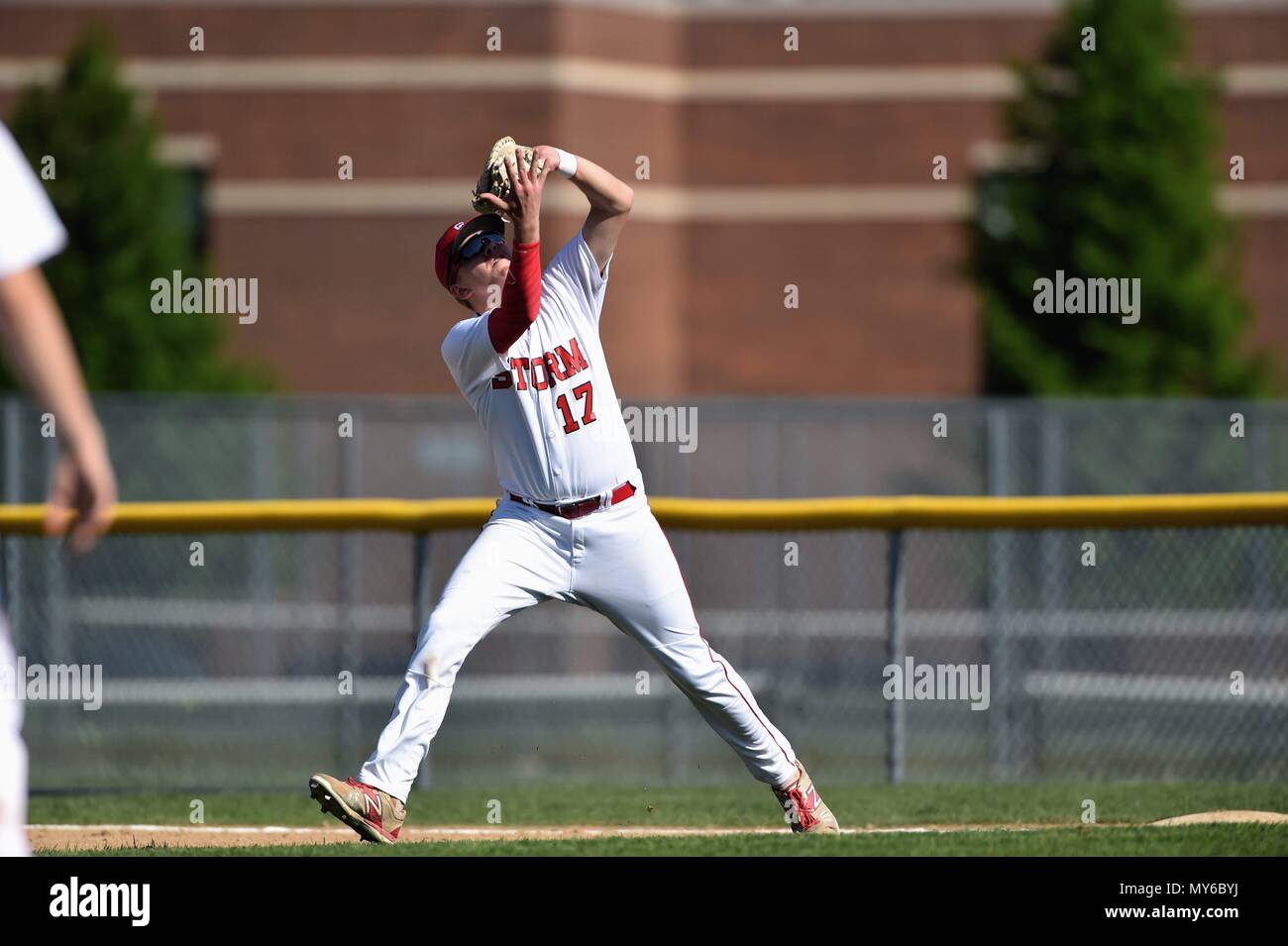 First baseman making a running catch of a pop fly. USA Stock Photo - Alamy