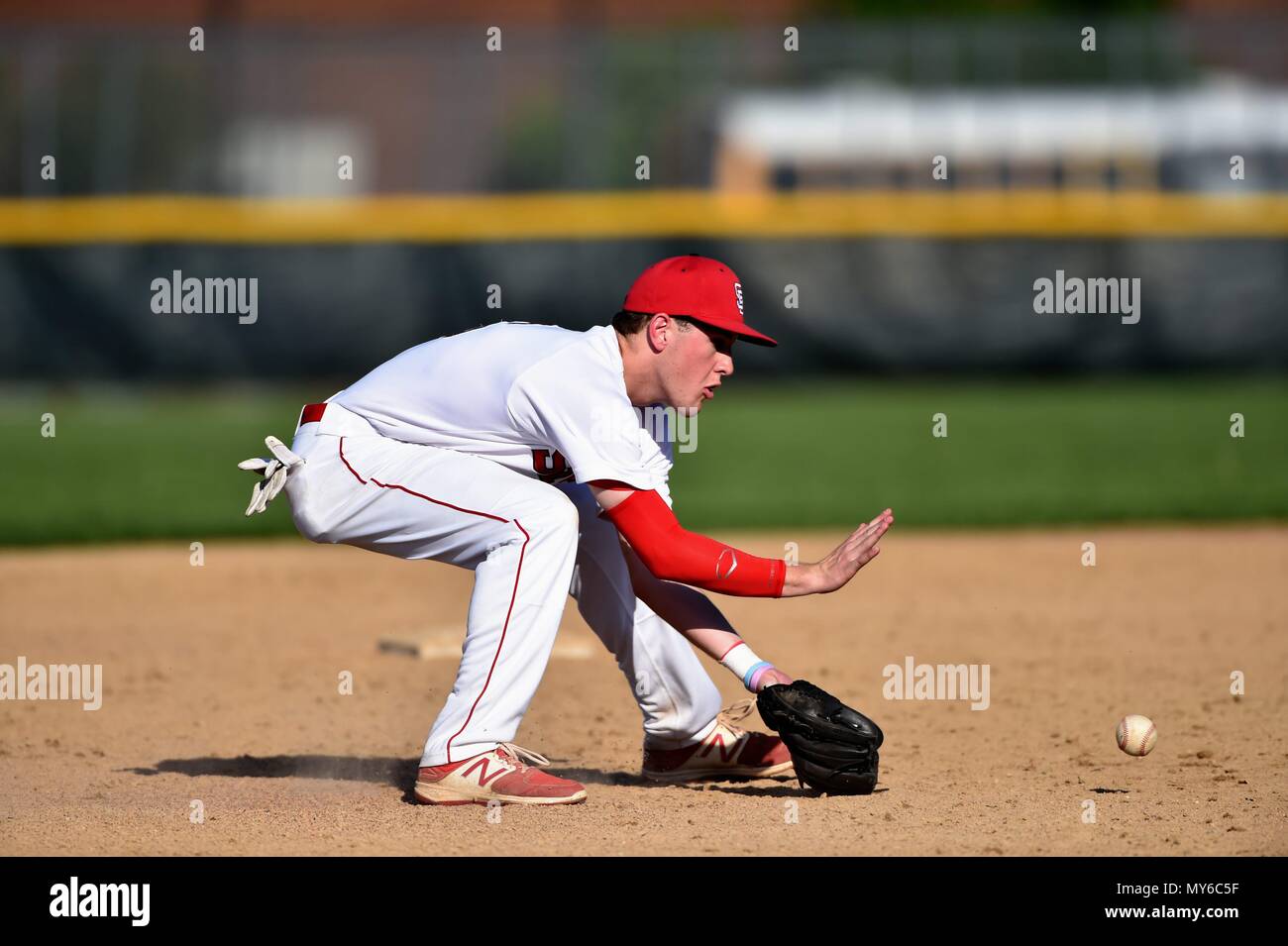 Shortstop fielding a ground ball prior to the throwing the batter out