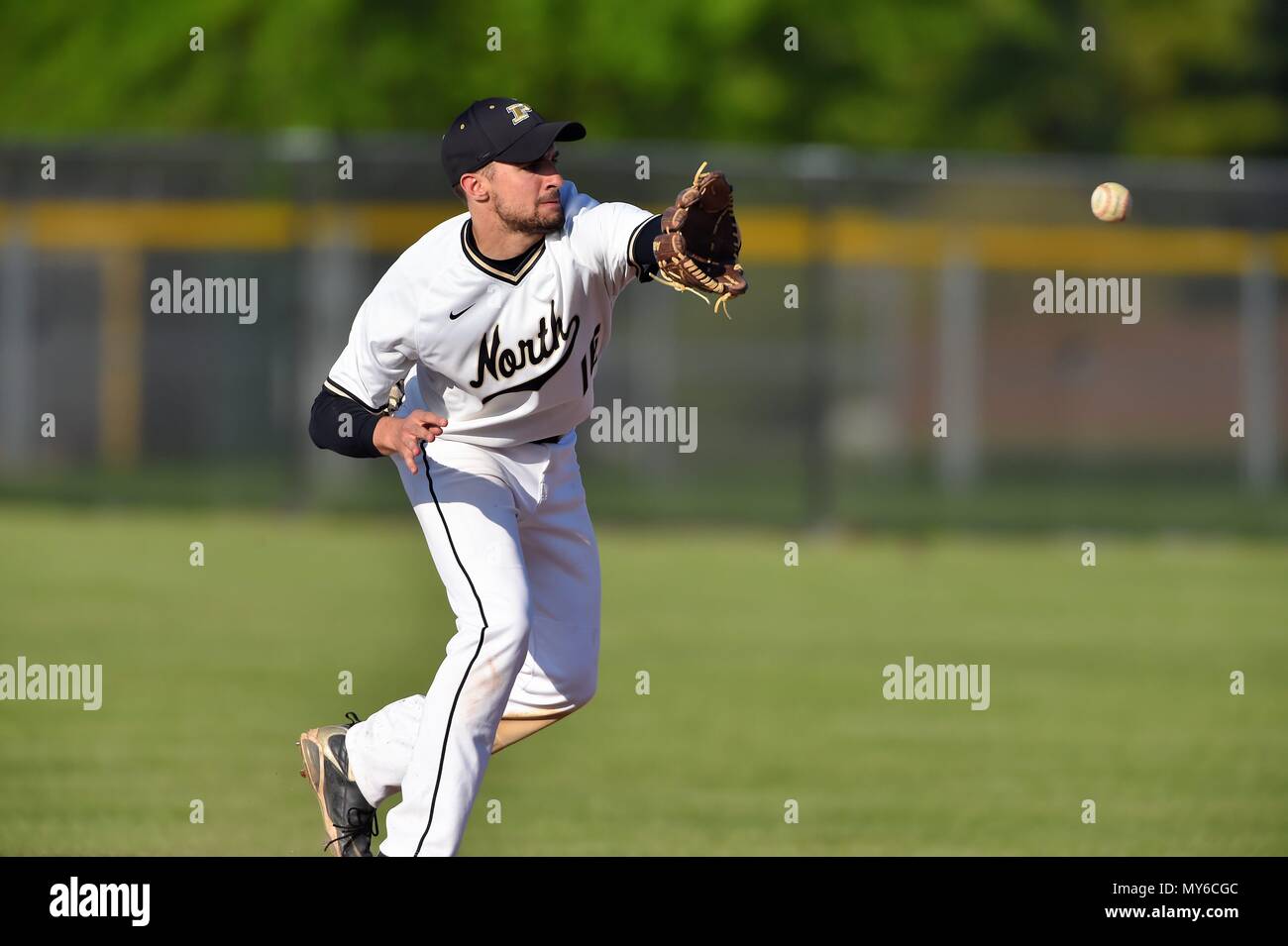 Shortstop fielding a ground ball before recording a force out at second base. USA. Stock Photo