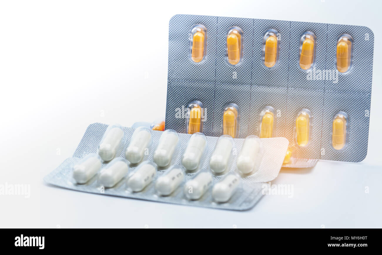 Cefixime and azithromycin capsule in blister pack for treatment gonorrhea. Neisseria Gonorrhoeae treatment. Antibiotic drug resistance. Orange and whi Stock Photo