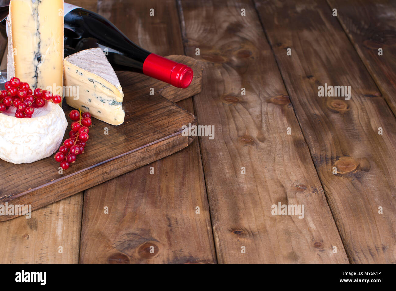 Different Cheese With White And Blue Mold A Red Wine And
