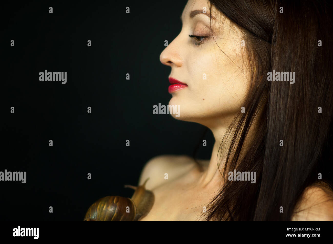 Side View of Young Woman Receiving Snail Neck Massage in Studio on ...