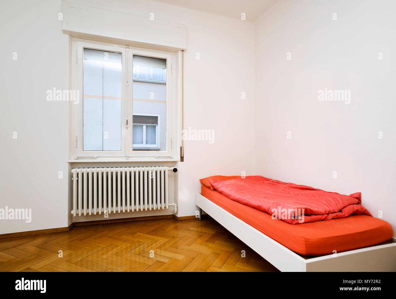 Interior of a small bedroom, nobody inside Stock Photo