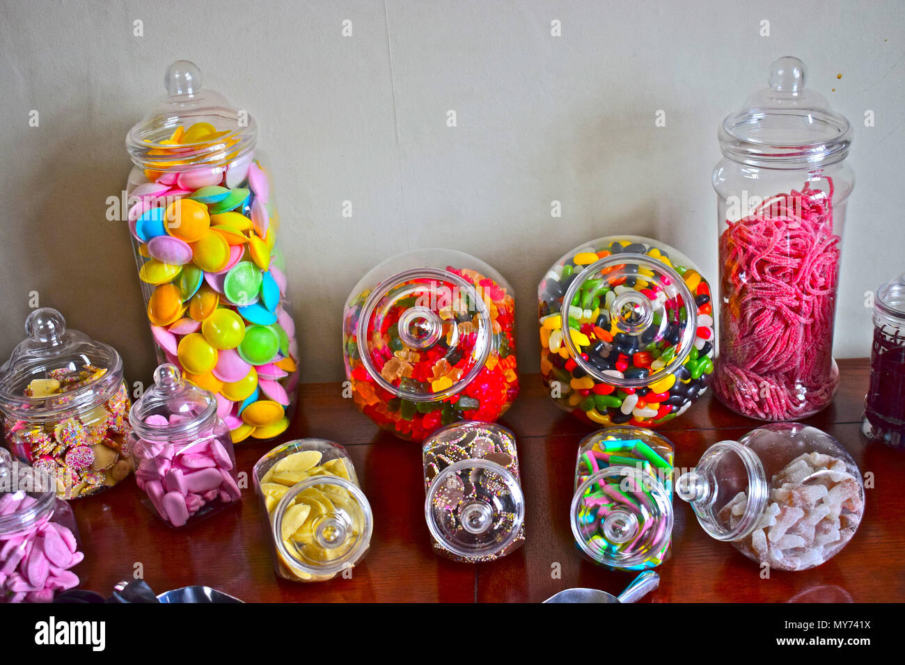 A colourful collection of old fashioned jars containing brightly coloured sweets Stock Photo
