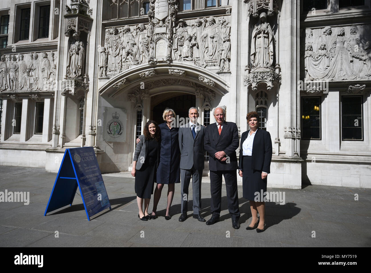 Surveyor Graham Mills (centre) and his legal team arrive at the UK Supreme Court, in London, where Supreme Court justices will consider the dispute over monthly maintenance payments between divorcee Maria Mills and her ex-husband Mr Mills, whose marriage ended 16 years ago. Stock Photo