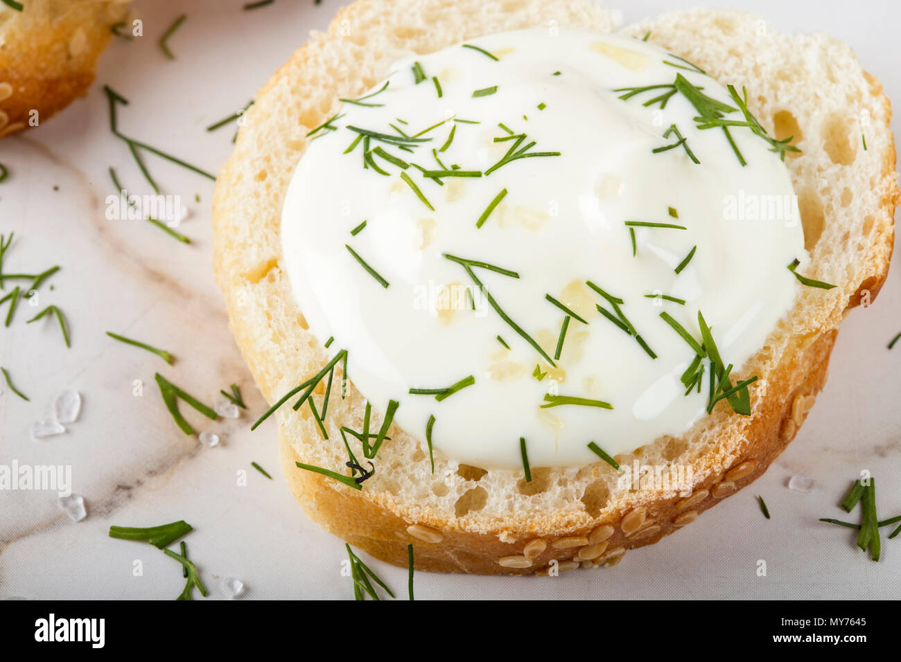 Appetizer made from bread, cheese cream and fresh green dill - top view Stock Photo