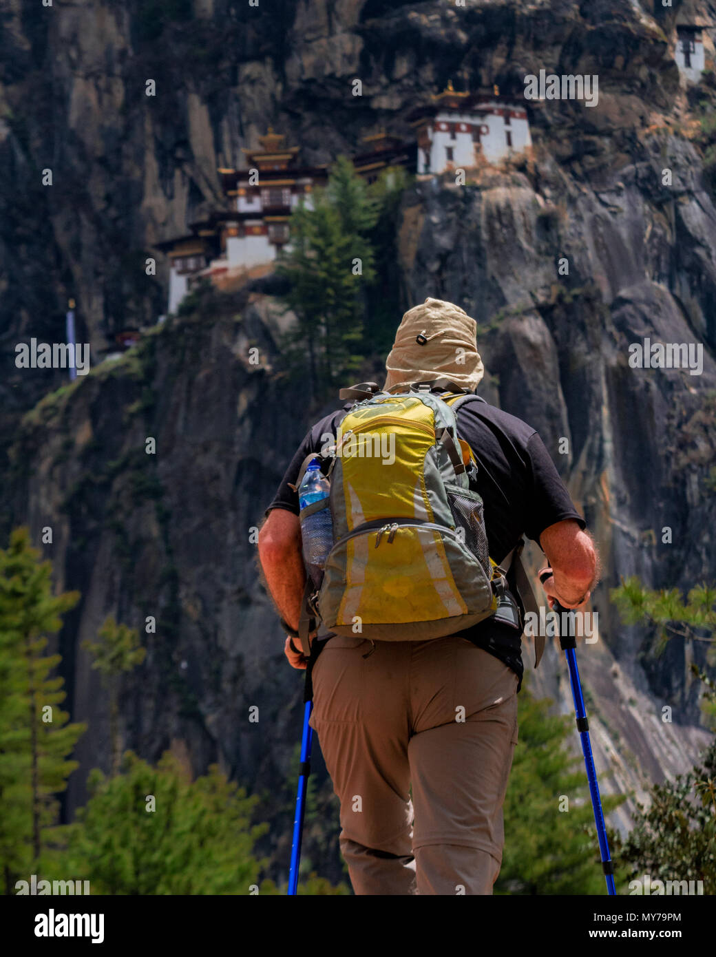 Man hiking up a Mountain Stock Photo