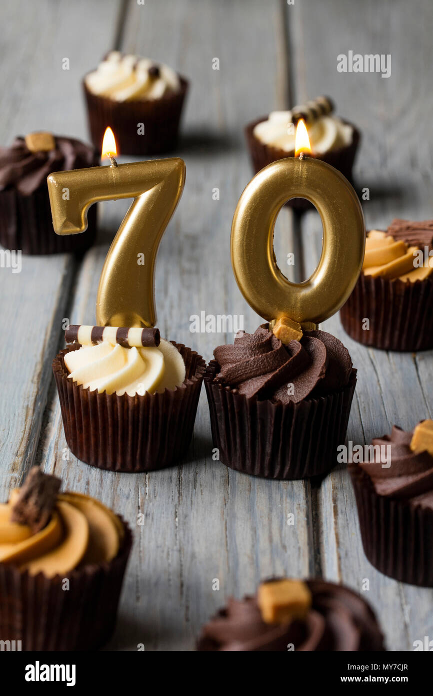 Number 70 celebration birthday cupcakes on a wooden background Stock Photo