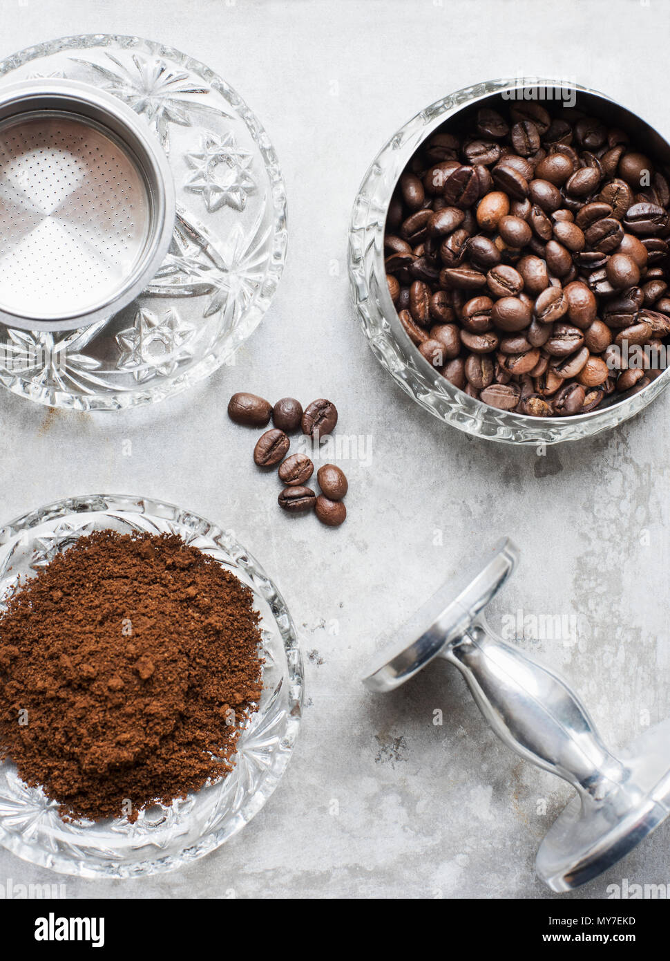 Bowls of fresh ground coffee and coffee beans, overhead view Stock Photo