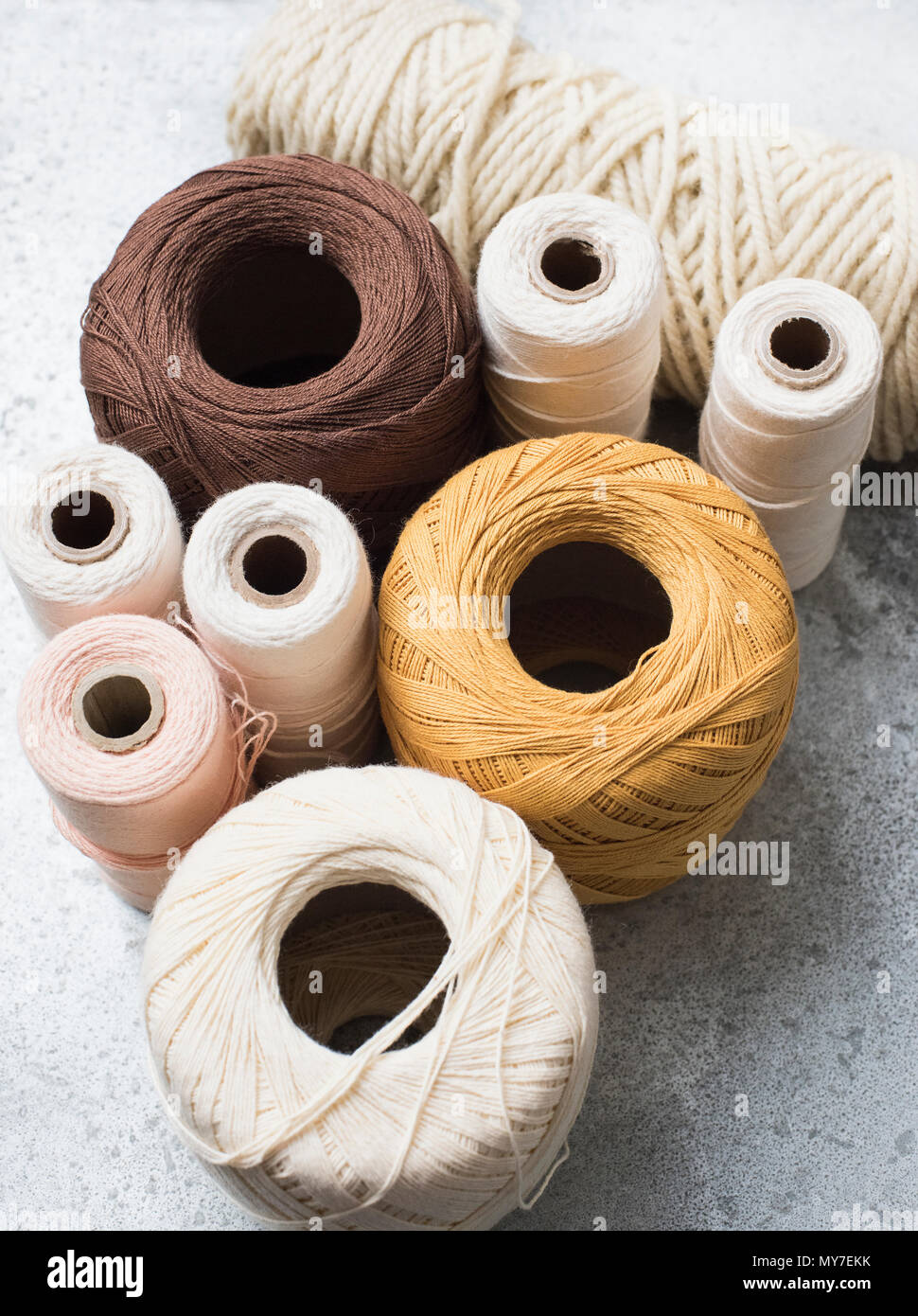 Still life with spools of yarn and string, overhead view Stock Photo