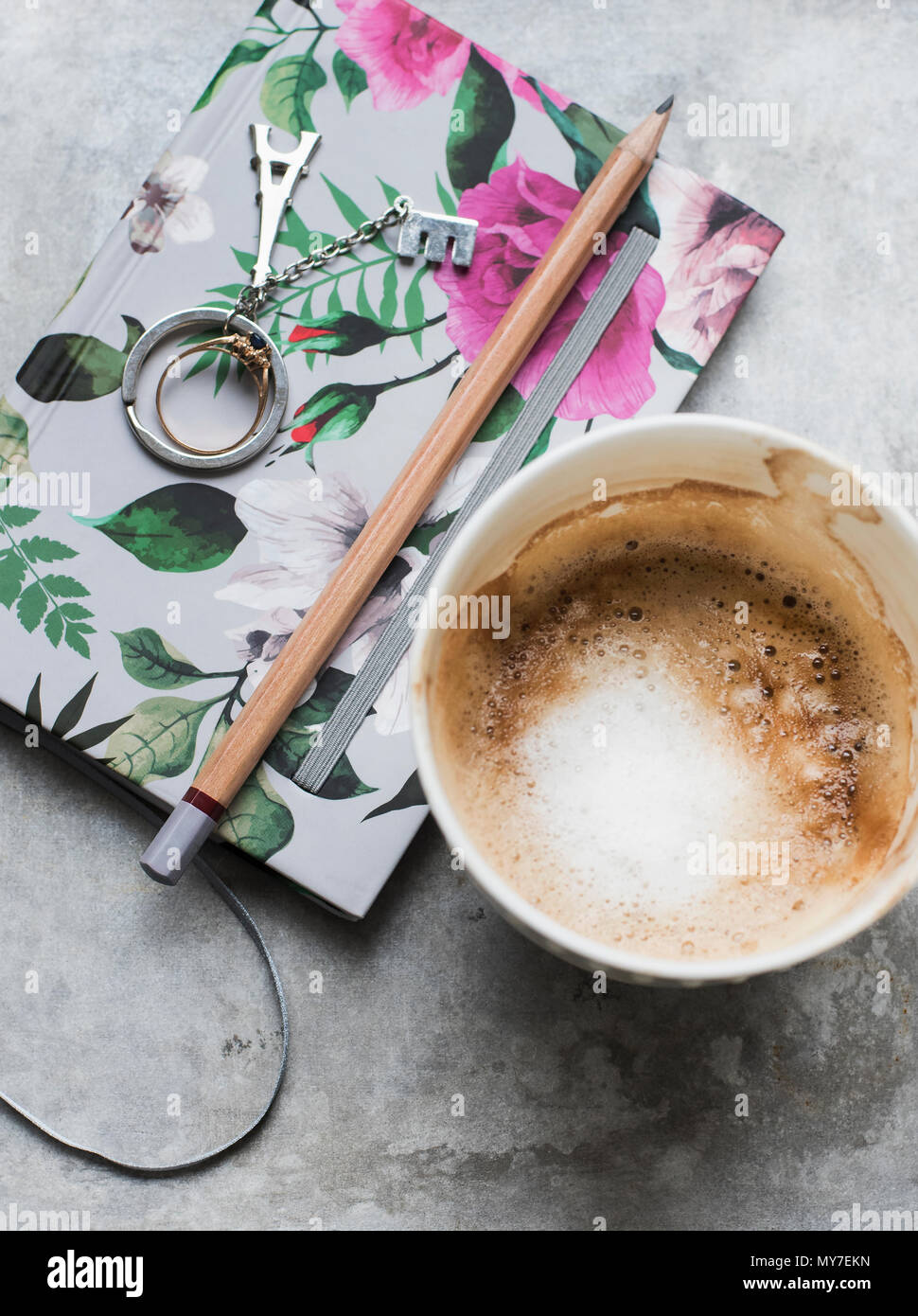 Cup of coffee with notebook and pencil, overhead view Stock Photo