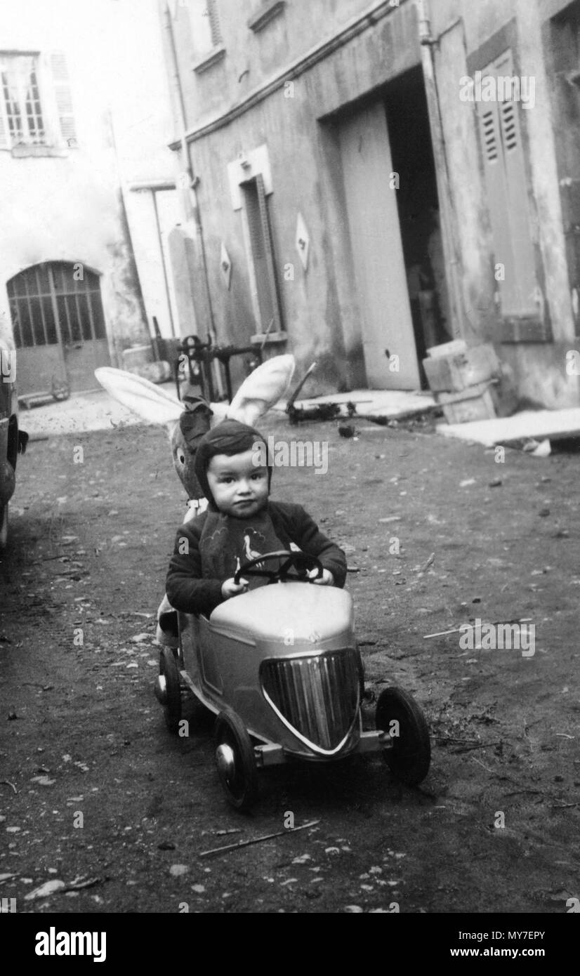 Old photograph, boy in a toy car, France Stock Photo