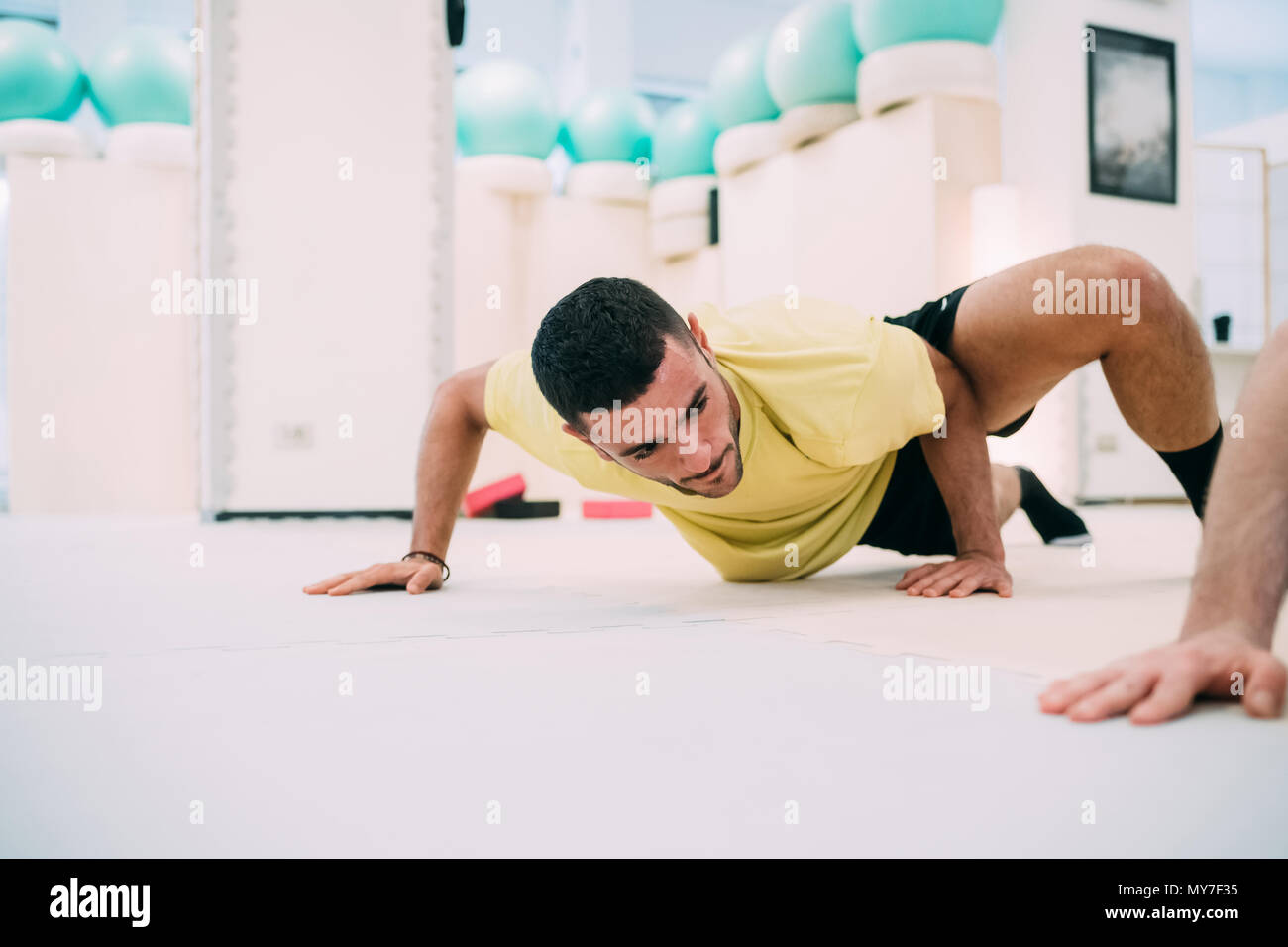 Man doing push ups Stock Photo