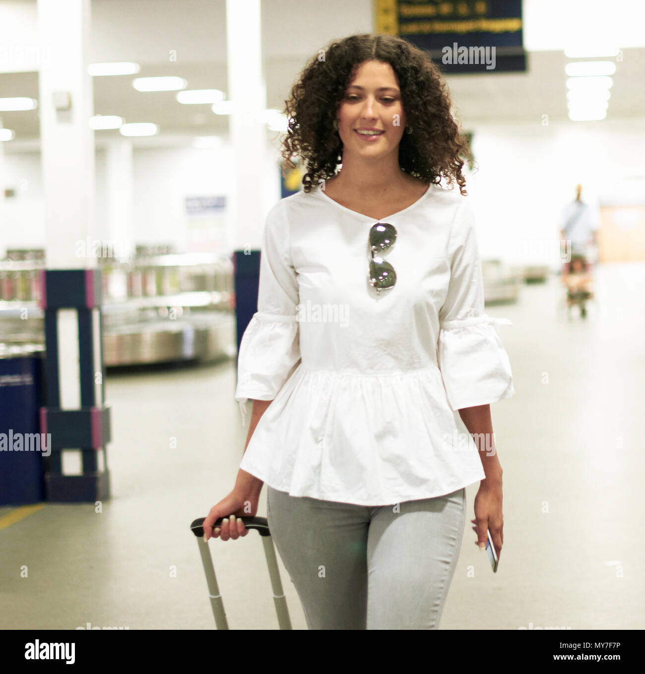 Suitcase airport woman hi-res stock photography and images - Alamy