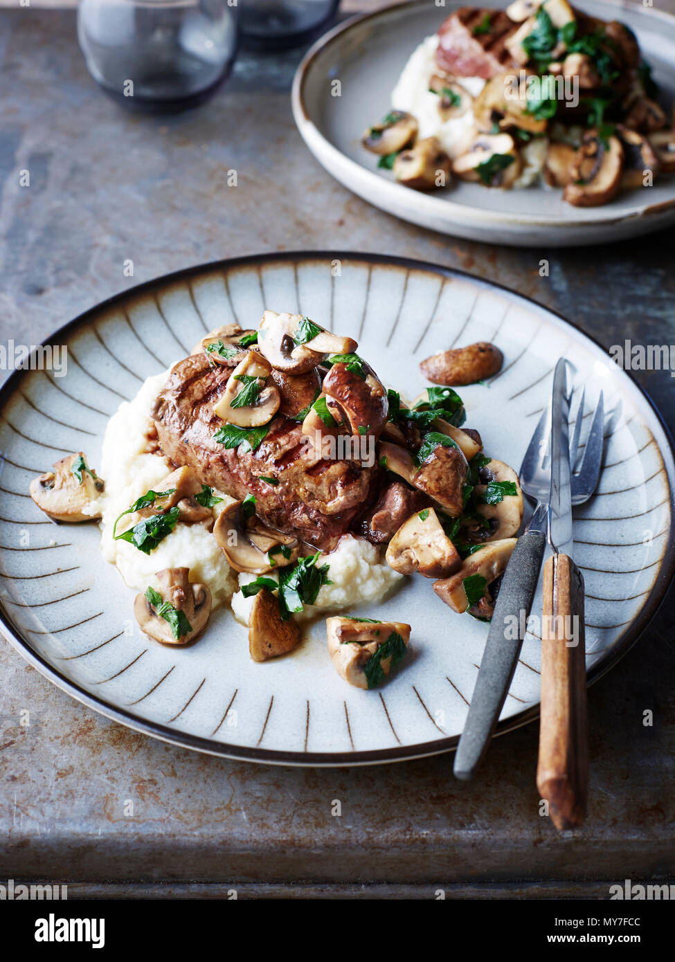 Fillet steak with mushrooms and cauliflower and horseradish mash, close-up Stock Photo