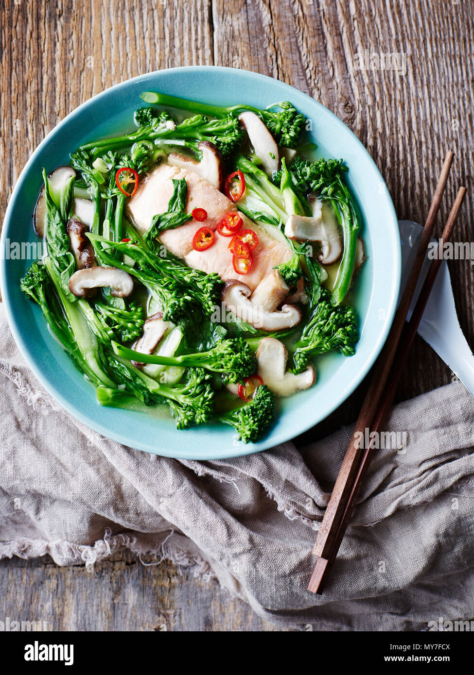 Salmon and miso soup with asian greens, overhead view Stock Photo