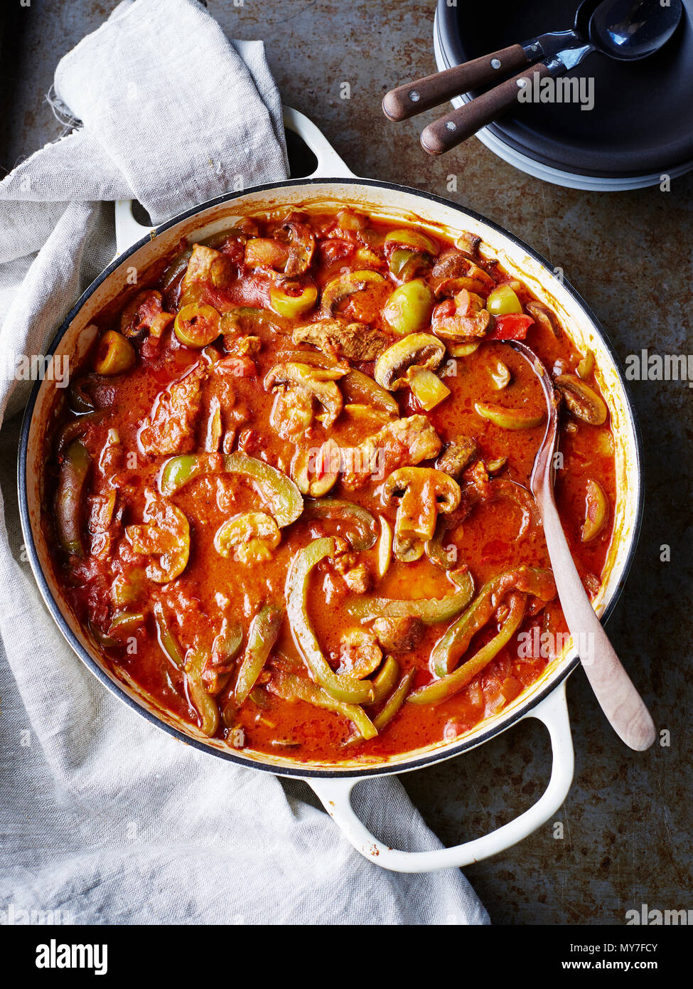 Spanish pork stew in serving dish, overhead view, close-up Stock Photo