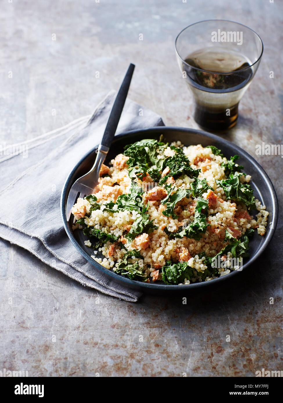 Still life with bowl of quinoa salmon kale salad, overhead view Stock Photo