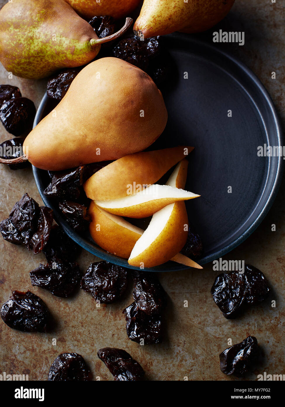 Still life with fresh pears and prunes, overhead view Stock Photo