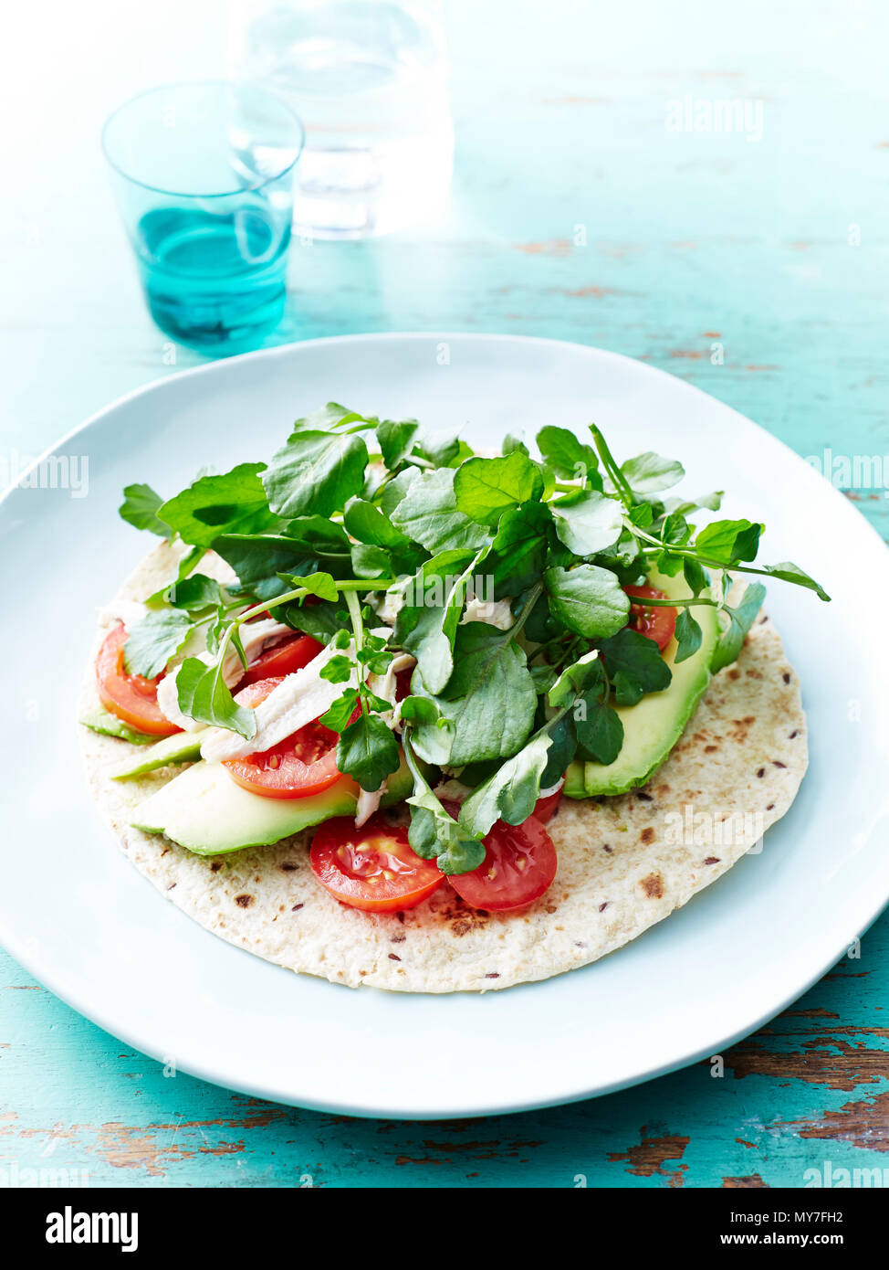 Chicken, avocado, watercress wrap Stock Photo