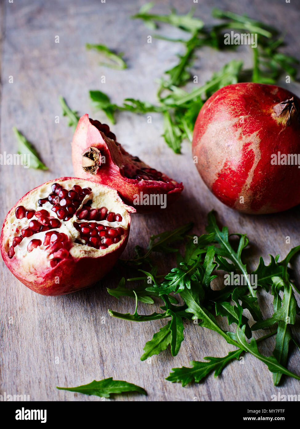 Pomegranate, rocket lettuce Stock Photo - Alamy