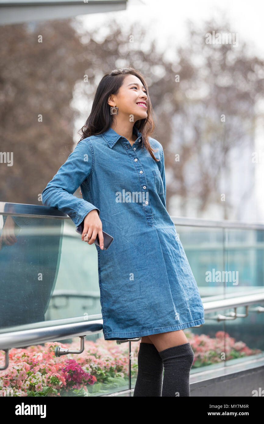 Picture of One beautiful young Chinese woman outdoor in the street Stock Photo