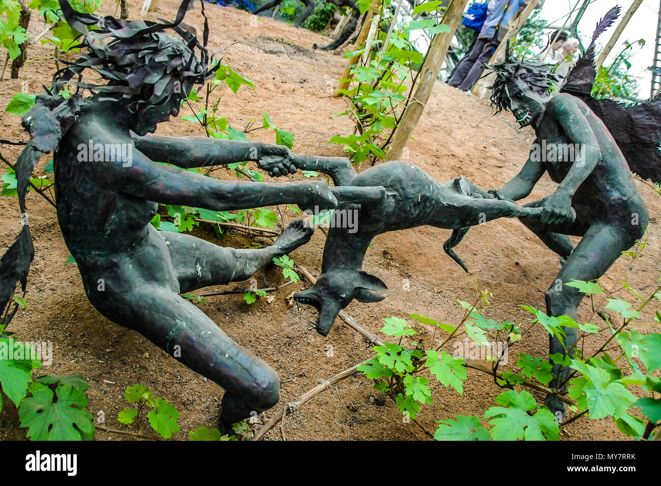 The Rites of Dionysus sculpture by Tim Shaw inside the Mediterranean Biome Bio Dome Eden Project, Cornwall. Copper beaten figures Stock Photo