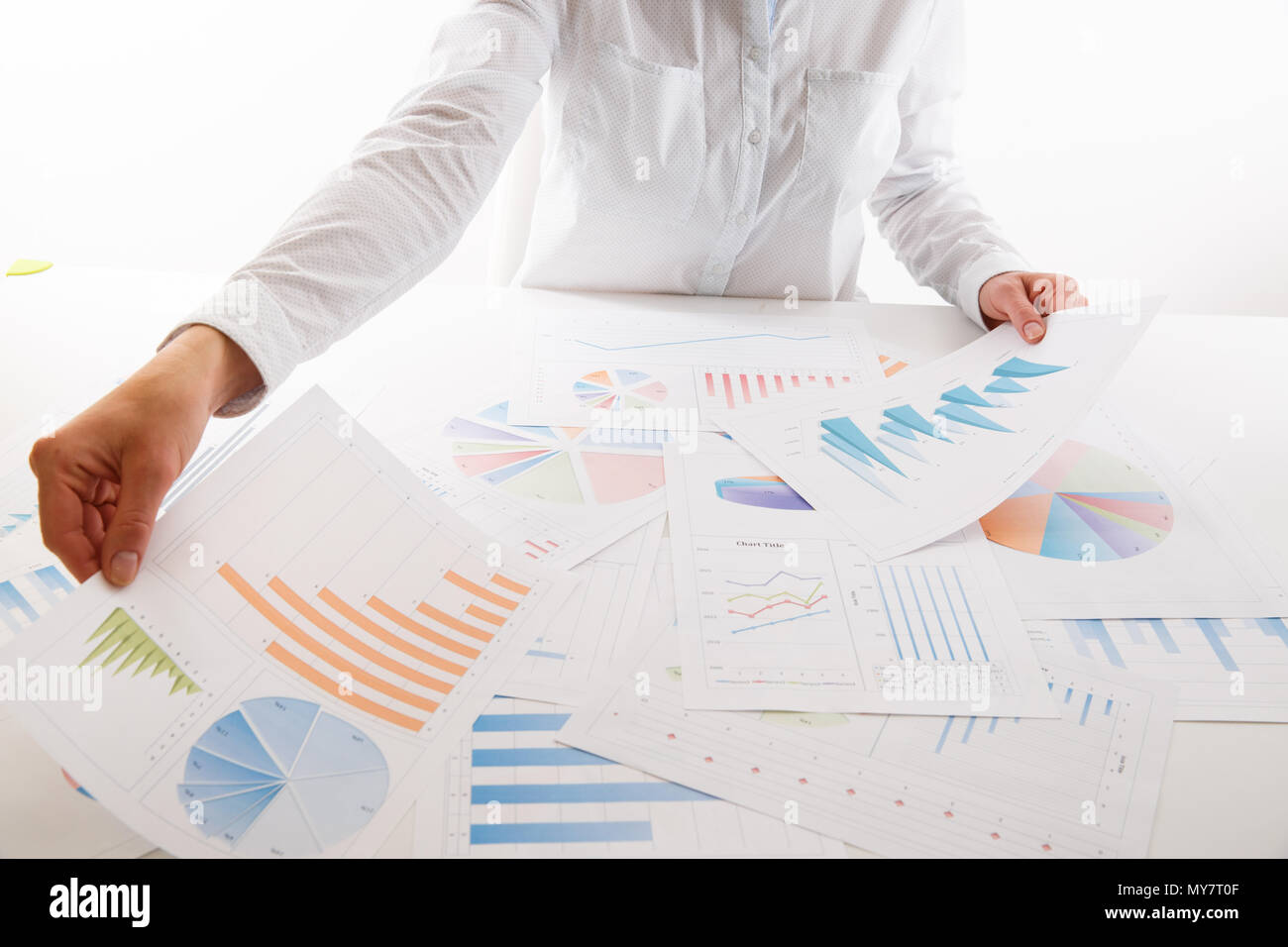 Business woman pointing at graph document close-up. Young business ...