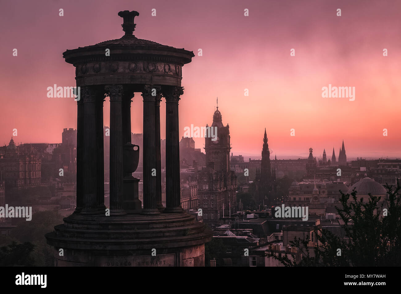 Cityscape of the monument to Dugald Stewart, sunset sky and the evening of Edinburgh, Scotland, United Kingdom Stock Photo