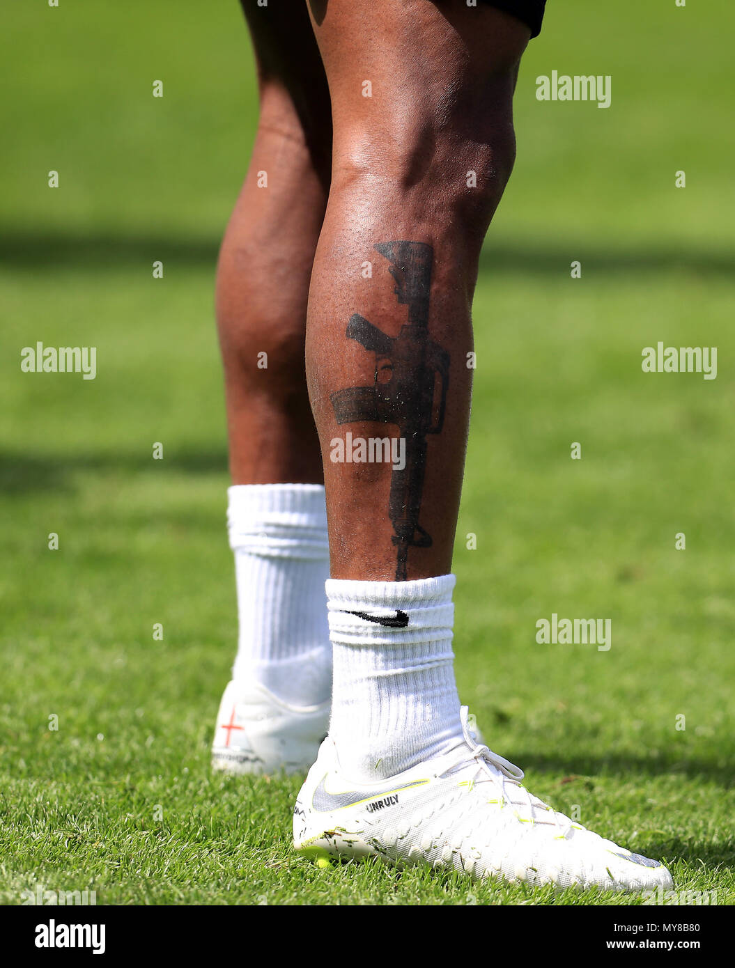 English footballer Raheem Sterling reveals touching new thigh tattoo of him  kissing young son Thiago - YouTube