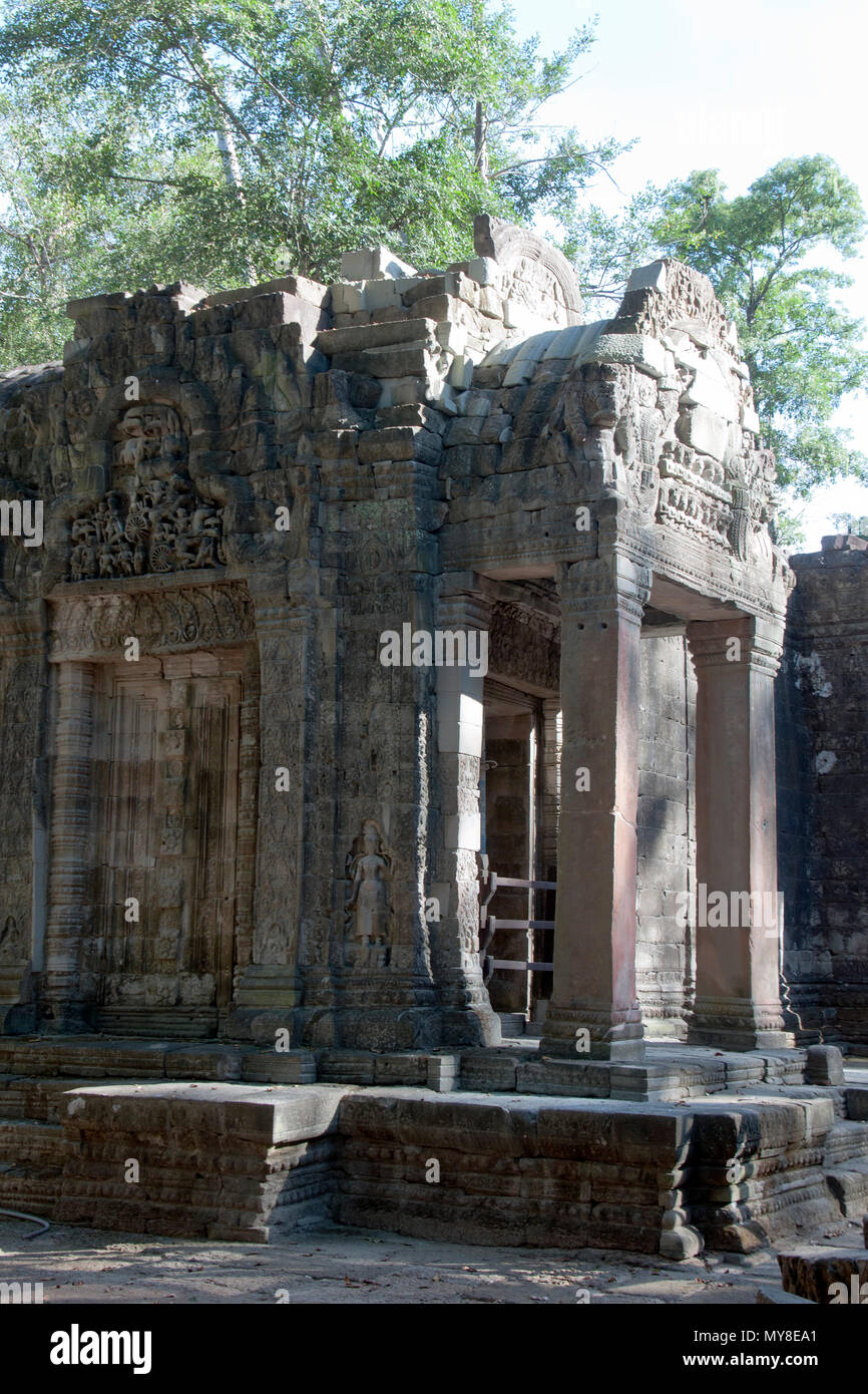 Siem reap Cambodia,  Ta Prohm a 12th century temple  entrance decorated with carvings and bas-relief Stock Photo