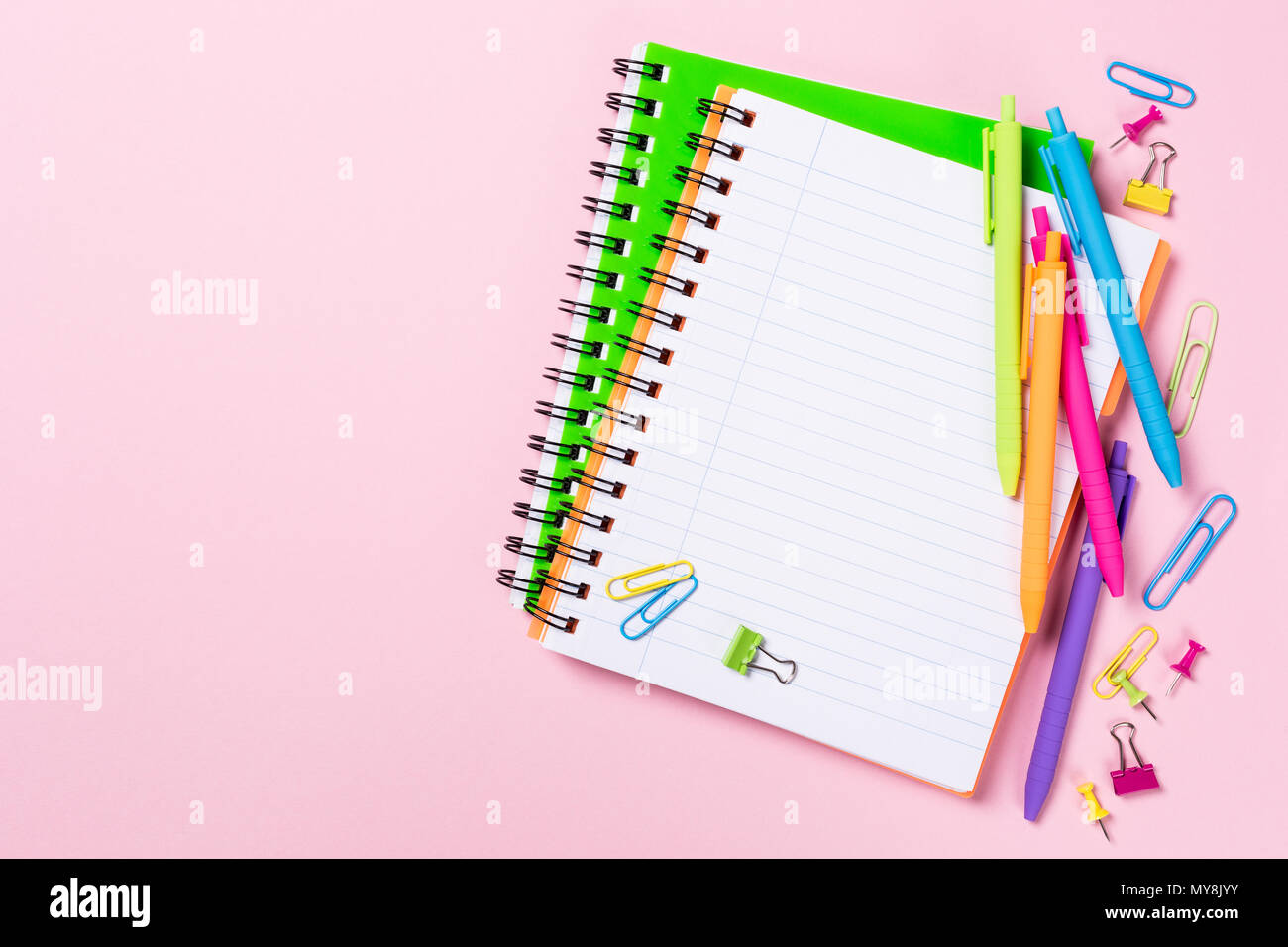 School background with notebooks and colorful supplies Stock Photo - Alamy