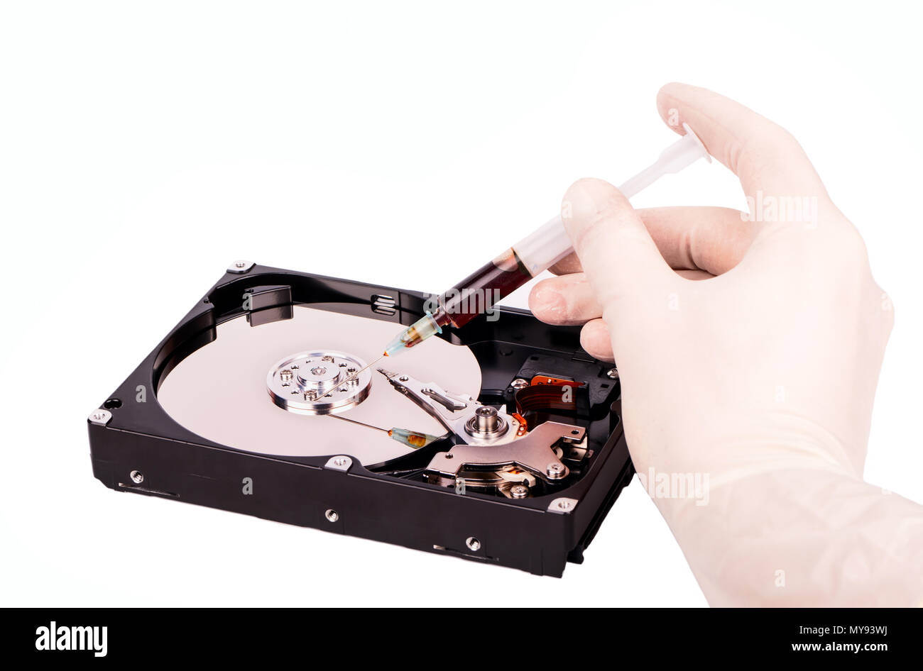Treatment of the hard disk with (HDD) a syringe and injection Stock ...