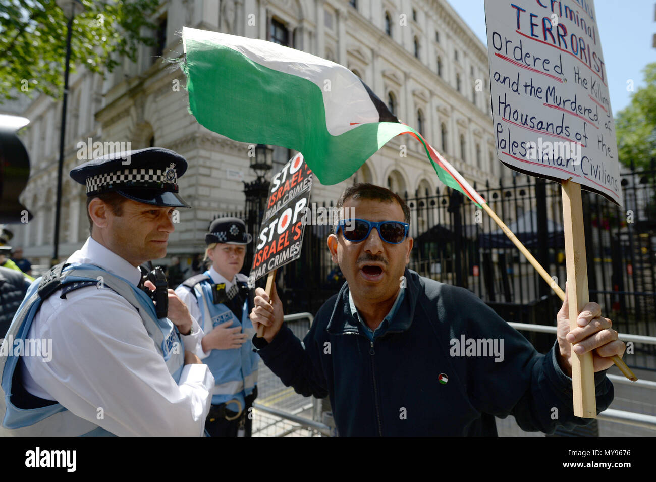 Demonstrators on Whitehall ahead of the arrival of Israeli Prime Minister Benjamin Netanyahu for a bilateral meeting with Prime Minister Theresa May at 10 Downing Street, London. Stock Photo