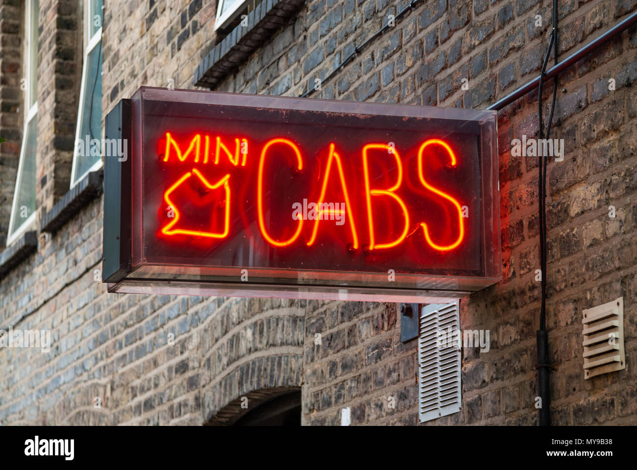 Mini cab office sign, London, UK Stock Photo