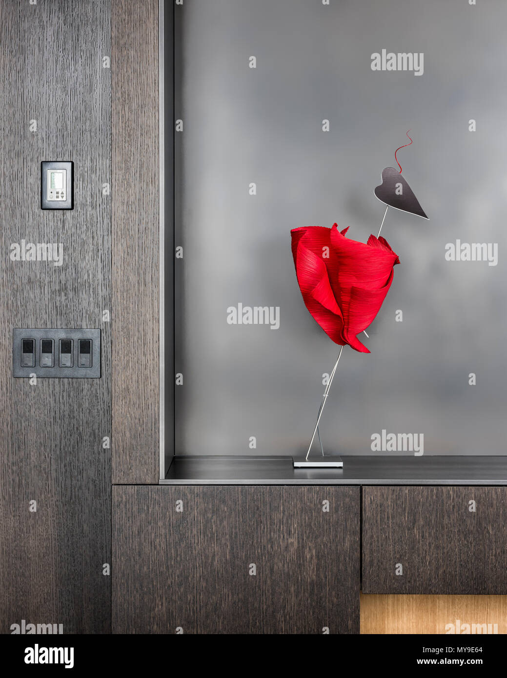 Heart shaped contemporary sculpture on recessed shelving Stock Photo