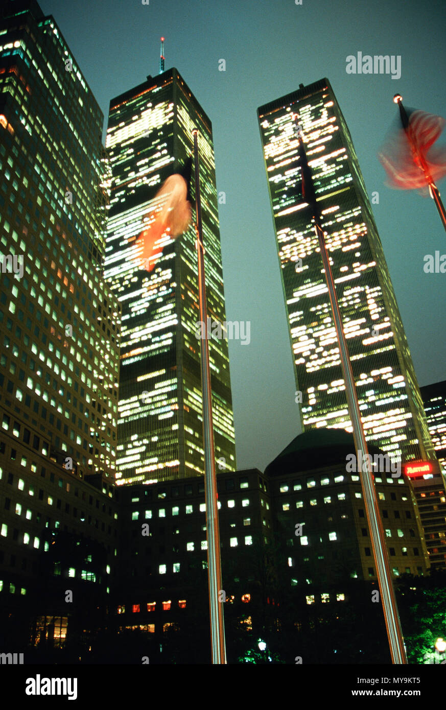 Flags Flying at Dusk in Front of World Trade Center Twin Towers, 1999, NYC, USA Stock Photo