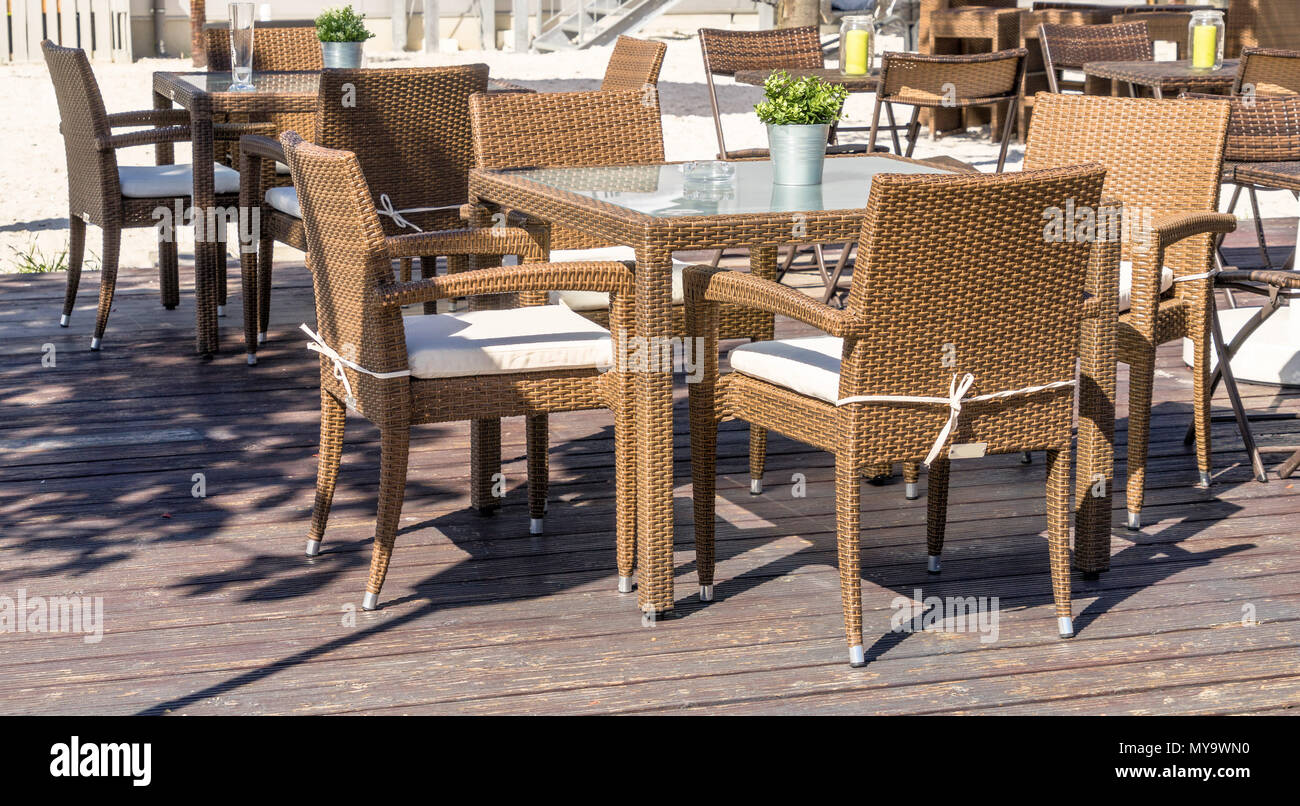 Unoccupied outdoor furniture in the outdoor area of a restaurant is waiting for the customers who eat, drink and smoke here, germany Stock Photo