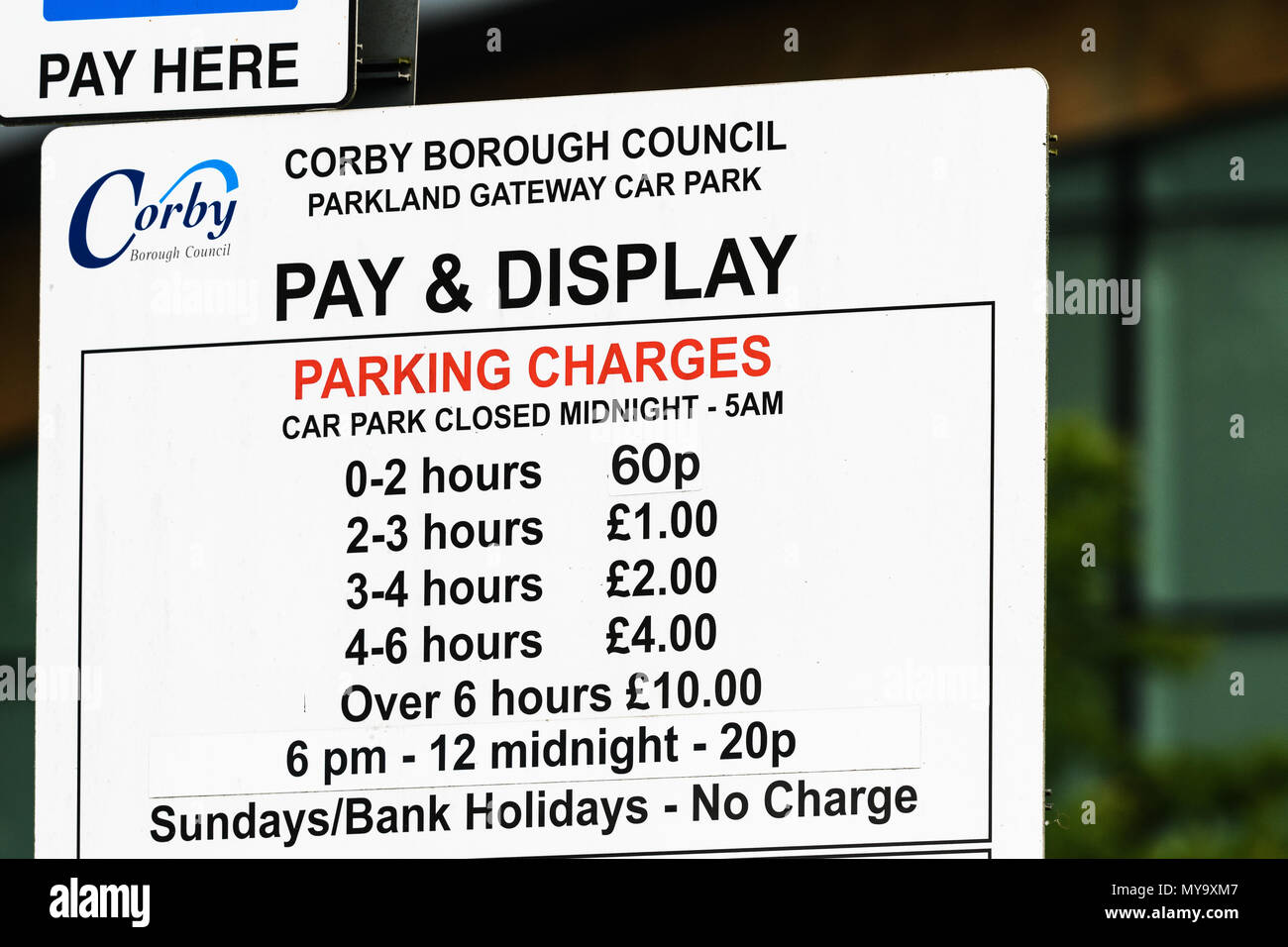 Car park pay and display parking charges notice outside the Cube in the town of Corby, Northamptonshire, England. Stock Photo